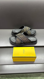 Fendi slide sandals, three-quarter view, FF monogram strap on dark platform