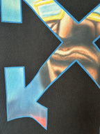 Close-up of multicolor arrow X print on dark T-shirt fabric