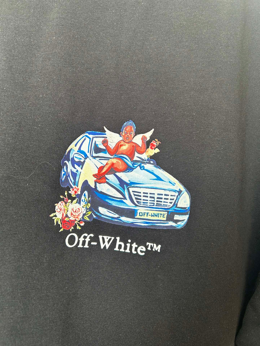 Off-White chest graphic of blue car, flowers, and Off-WhiteTM lettering