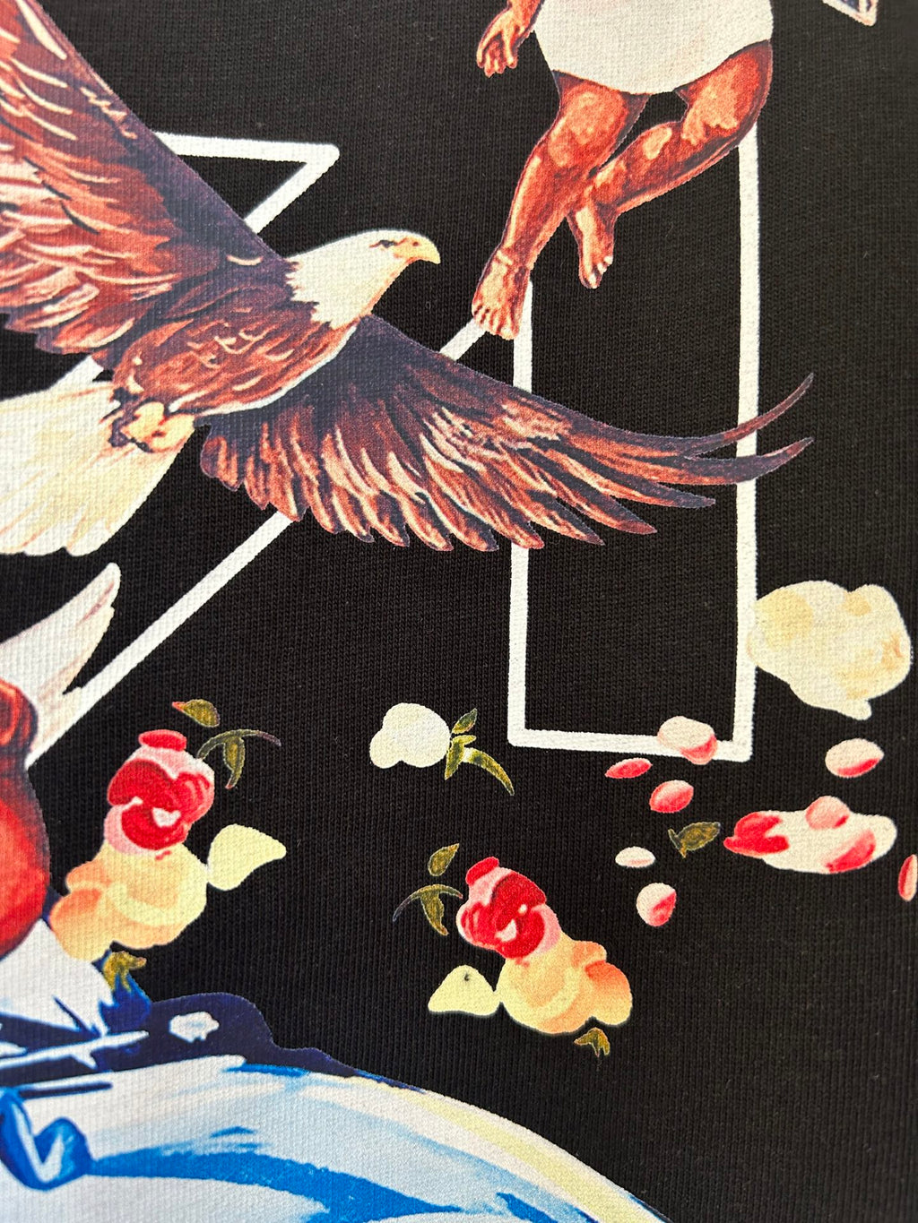 Off-White dark T-shirt graphic with bird wings and scattered shapes