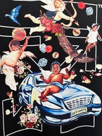 Off-White dark T-shirt graphic: winged figures, roses, and blue car