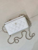 Chanel white quilted crossbody bag with chain strap, zip top, CC logo front.