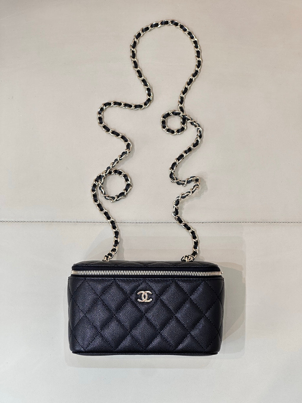 Chanel quilted mini crossbody bag, dark navy with gold-tone zipper and chain