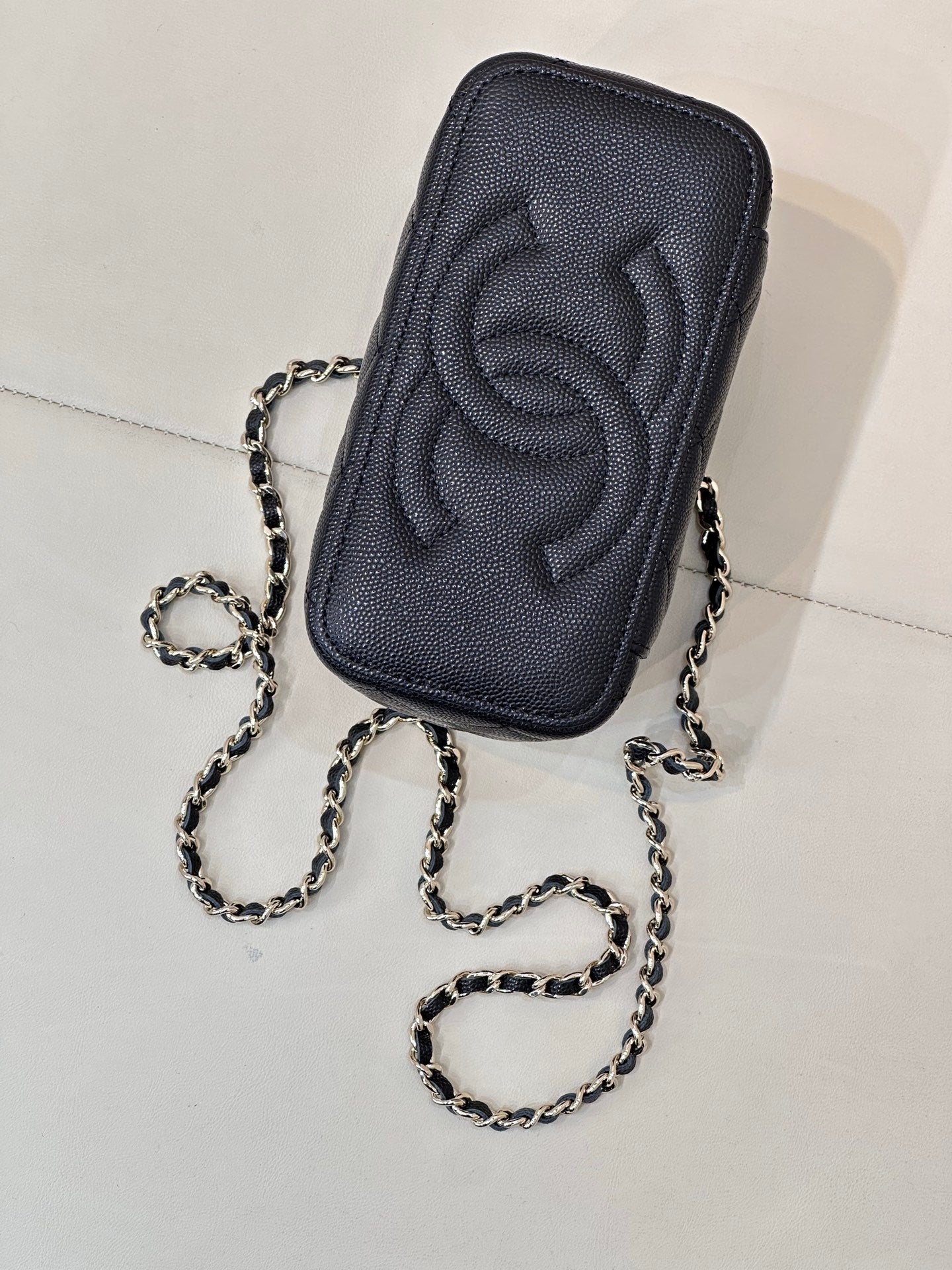 Chanel quilted mini bag back, dark navy leather with embossed CC and chain
