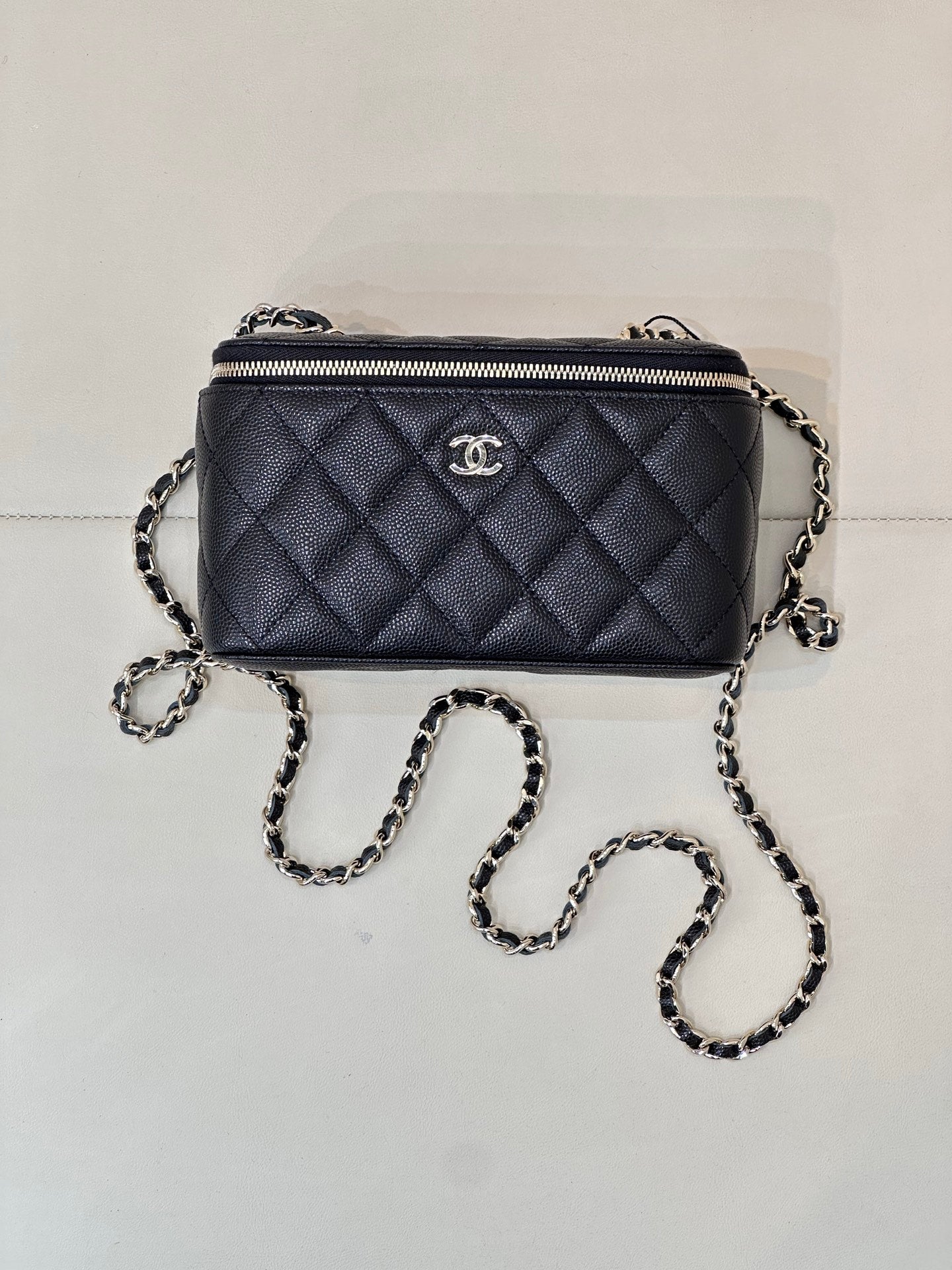 Chanel quilted mini crossbody bag, dark navy, gold-tone zipper front view
