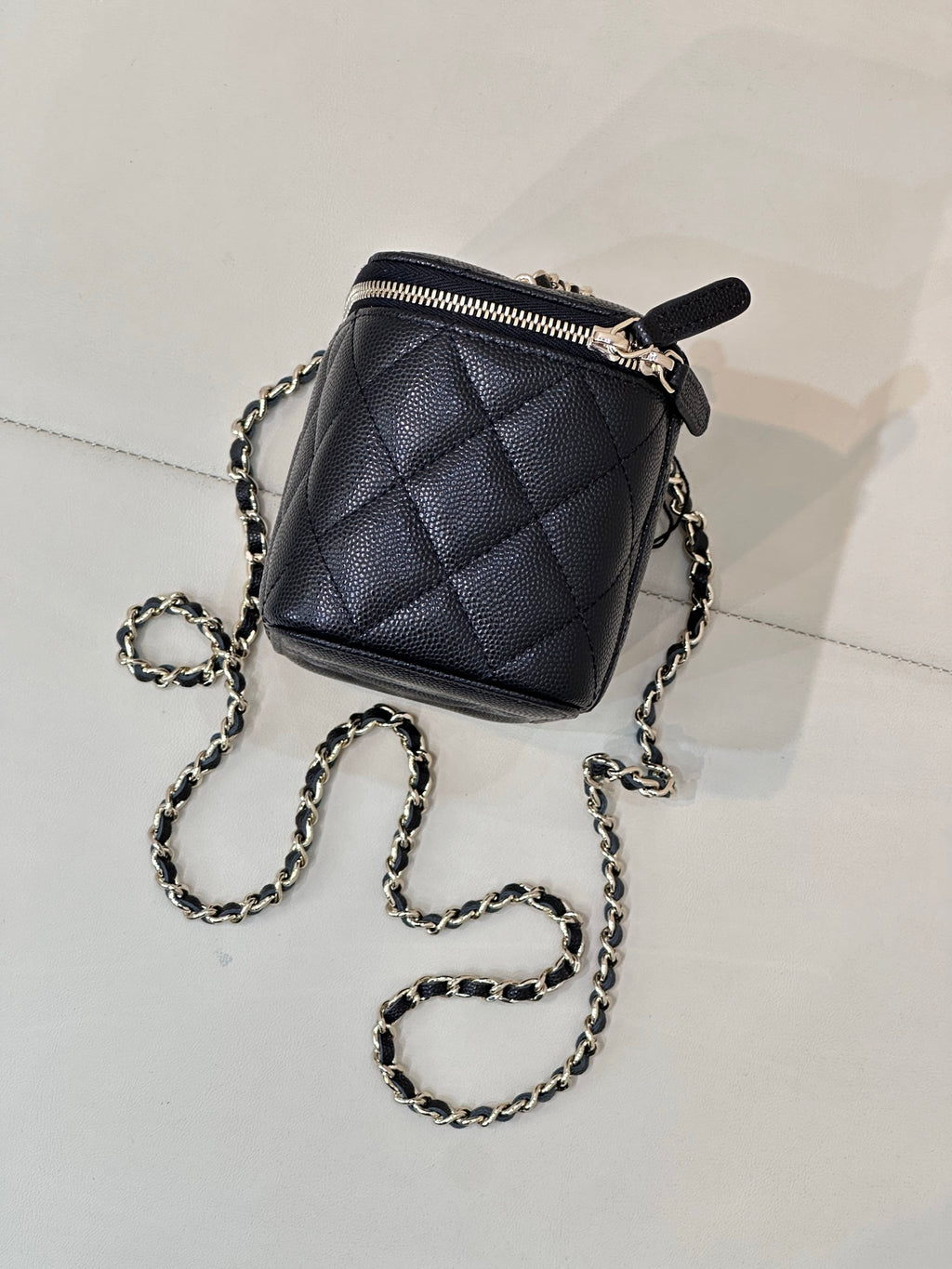 Chanel quilted mini bag, dark navy, chain strap and zip-top with pull tab