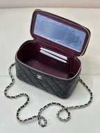 Chanel quilted mini bag open, dark navy exterior with burgundy card slots