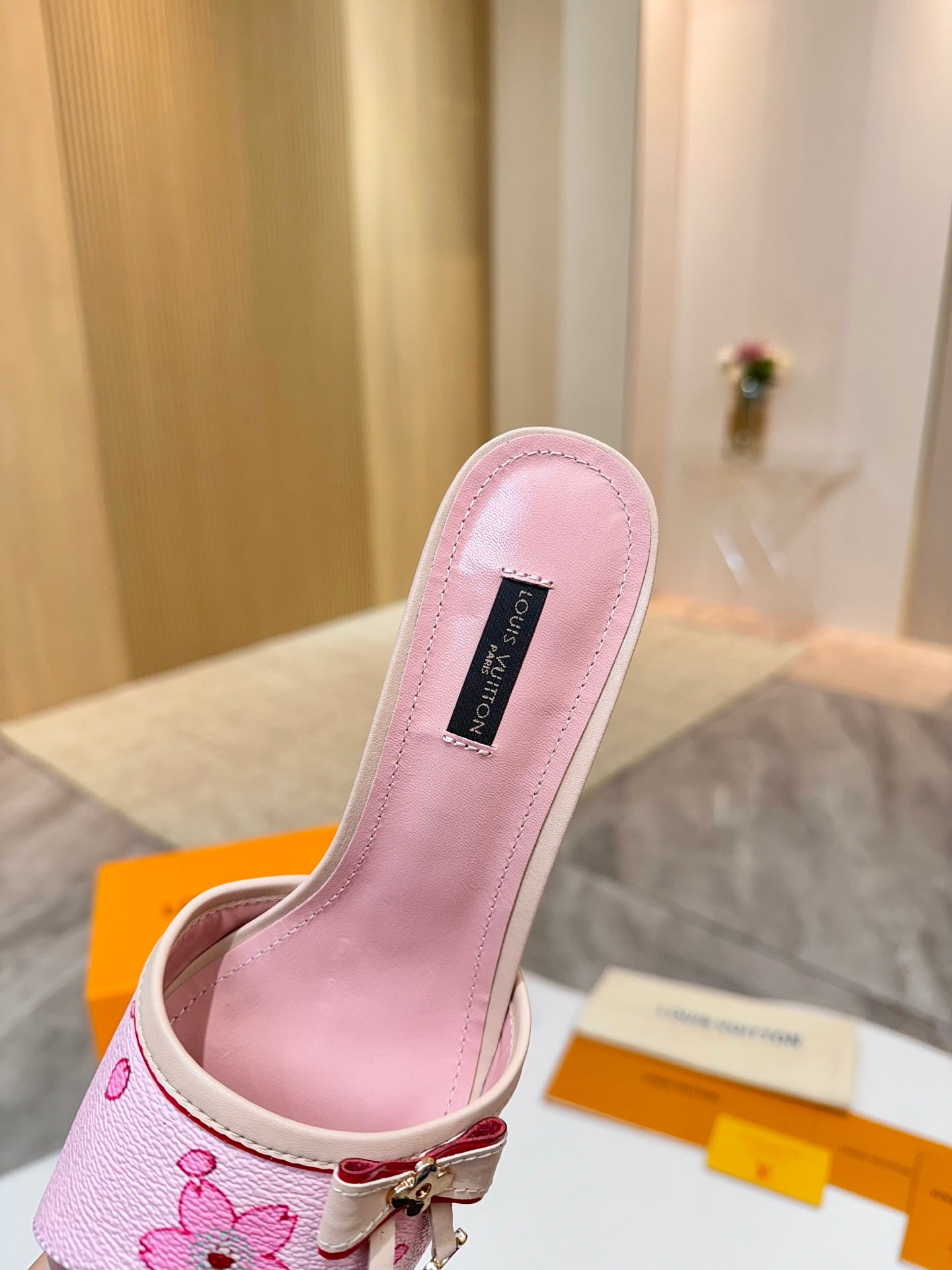 Pink Louis Vuitton ladies mule insole view with brand label and open strap
