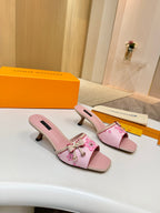 Pink Louis Vuitton ladies mule shoes on heels, with flower strap and gold buckle