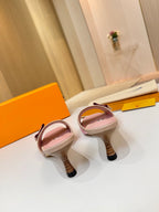 Pink Louis Vuitton ladies mules viewed from back: heel and open strap detail
