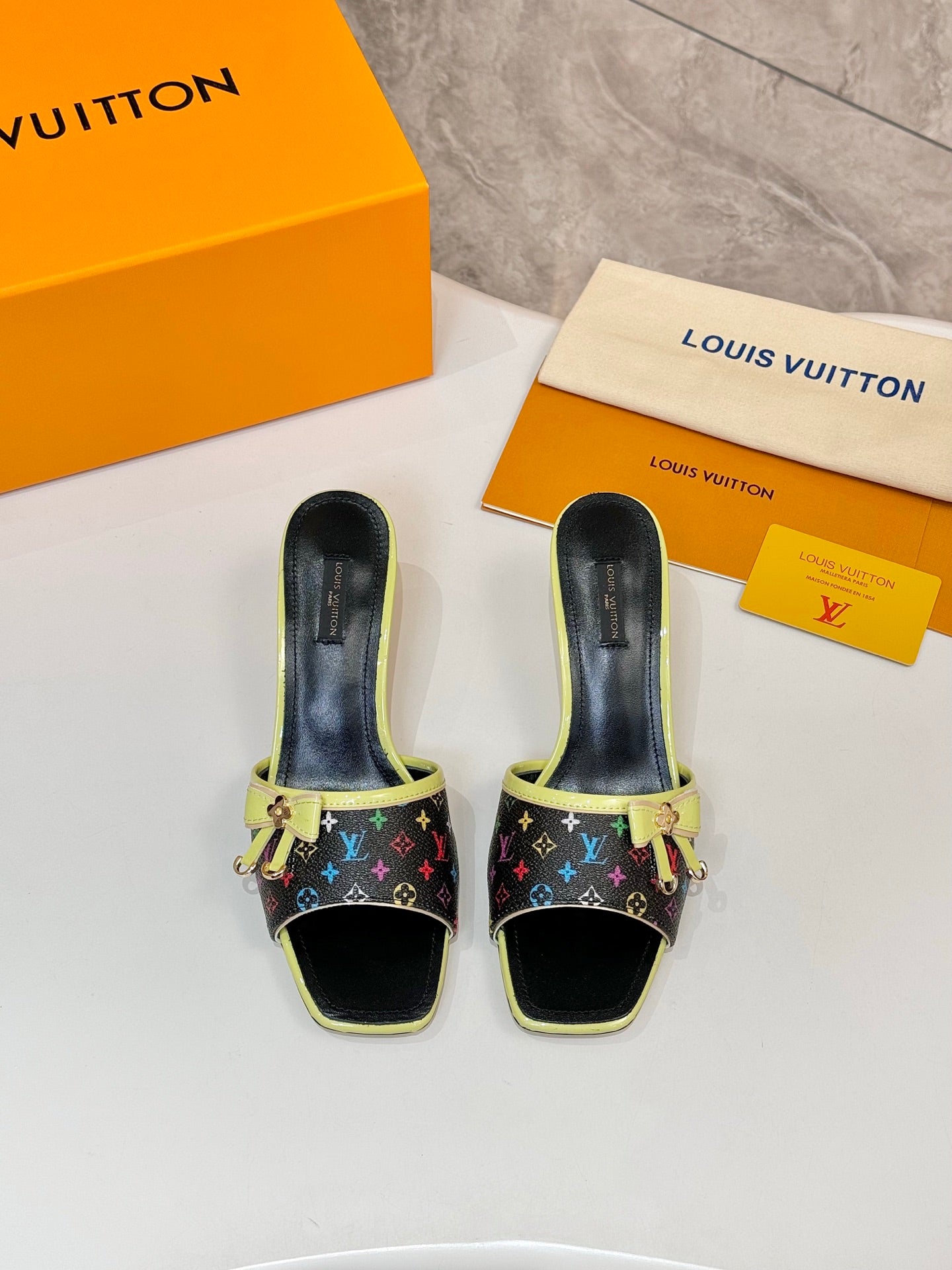 Louis Vuitton ladies mule sandals, multicolor monogram with lime green trim and low heels