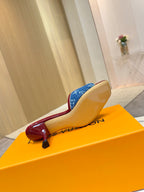 Louis Vuitton ladies blue monogram slide mule showing outsole and heel, red trim detail