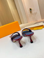 Louis Vuitton ladies blue monogram slide mules, red-trimmed straps and covered heel, side view