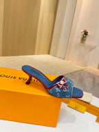 Louis Vuitton ladies blue monogram slide mules with red trim and bow detail, low heel