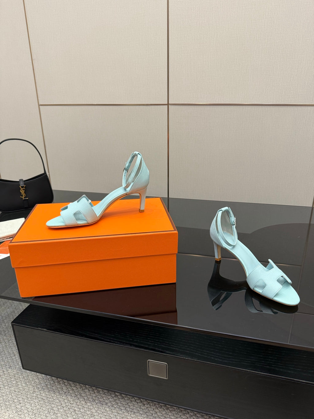 Hermes women's light-blue leather slingback sandals, angled view with slim stiletto heel