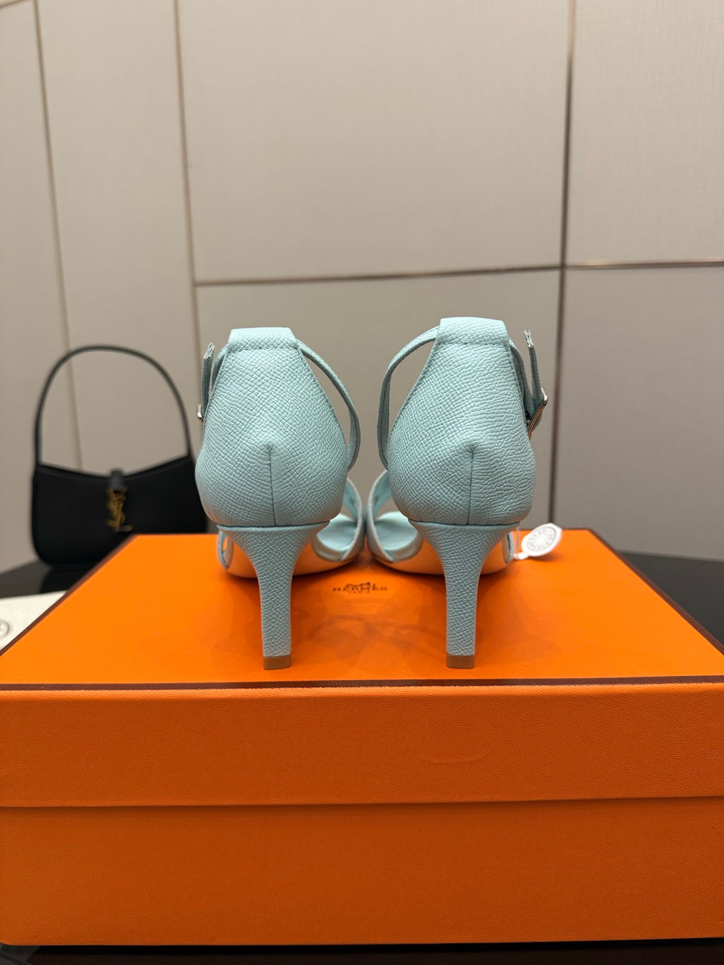 Hermes women's light-blue leather slingback sandals, rear view, stiletto heel and strap