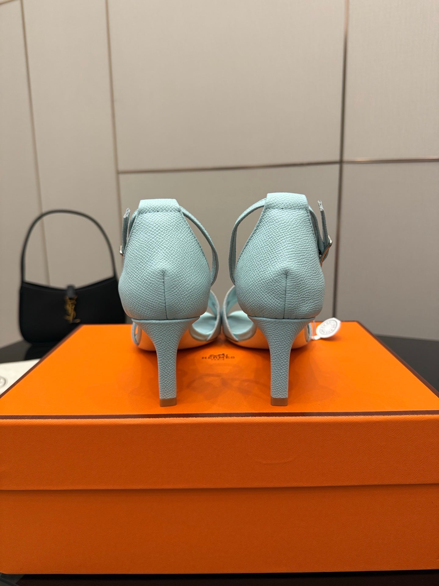 Hermes women's light-blue leather slingback sandals, rear view, stiletto heel and strap