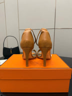Hermes tan leather heeled sandals for ladies, open back with ankle strap, rear view pair