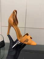 Hermes ladies tan heeled sandals, close side view with open toe and stiletto