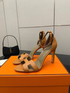 Hermes tan leather heeled sandals for ladies, open toe with ankle strap, front close-up pair