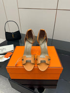 Hermes tan leather heeled sandals for ladies, open toe with ankle strap, front view pair