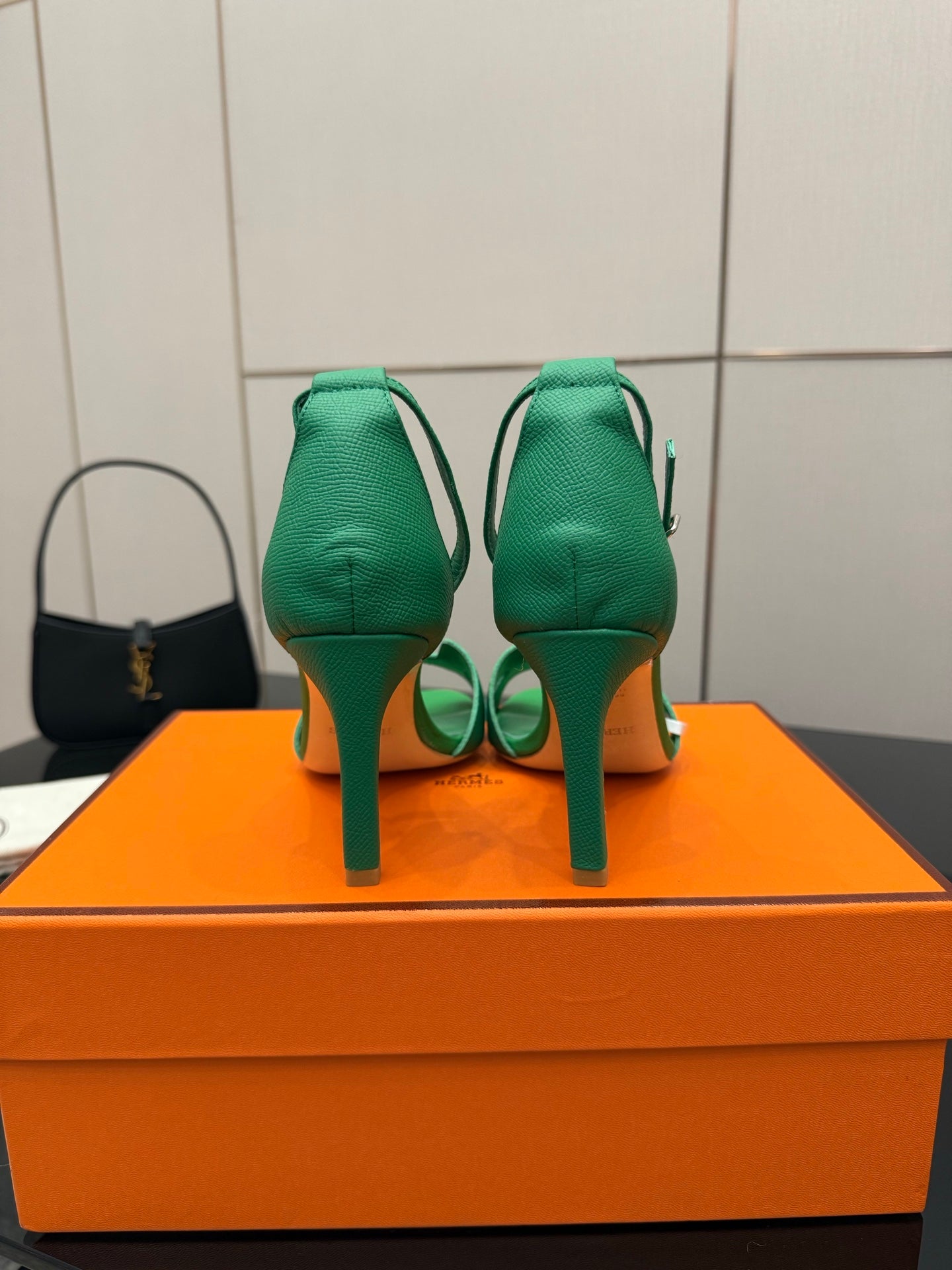 Hermes ladies green heeled sandals, back view with ankle strap loops