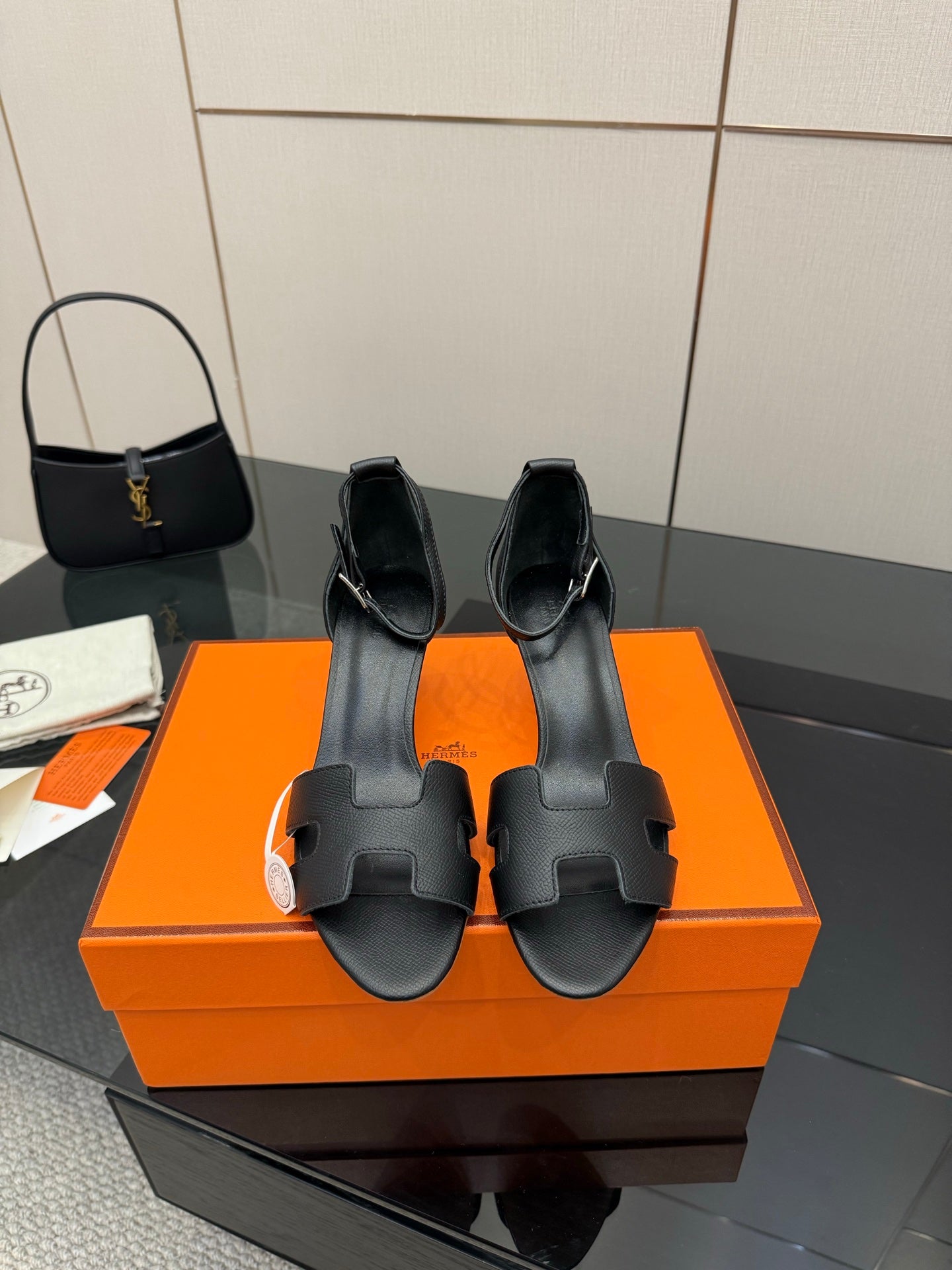 Black leather heeled mule sandals with square-toe cutouts and slip-on strap detail