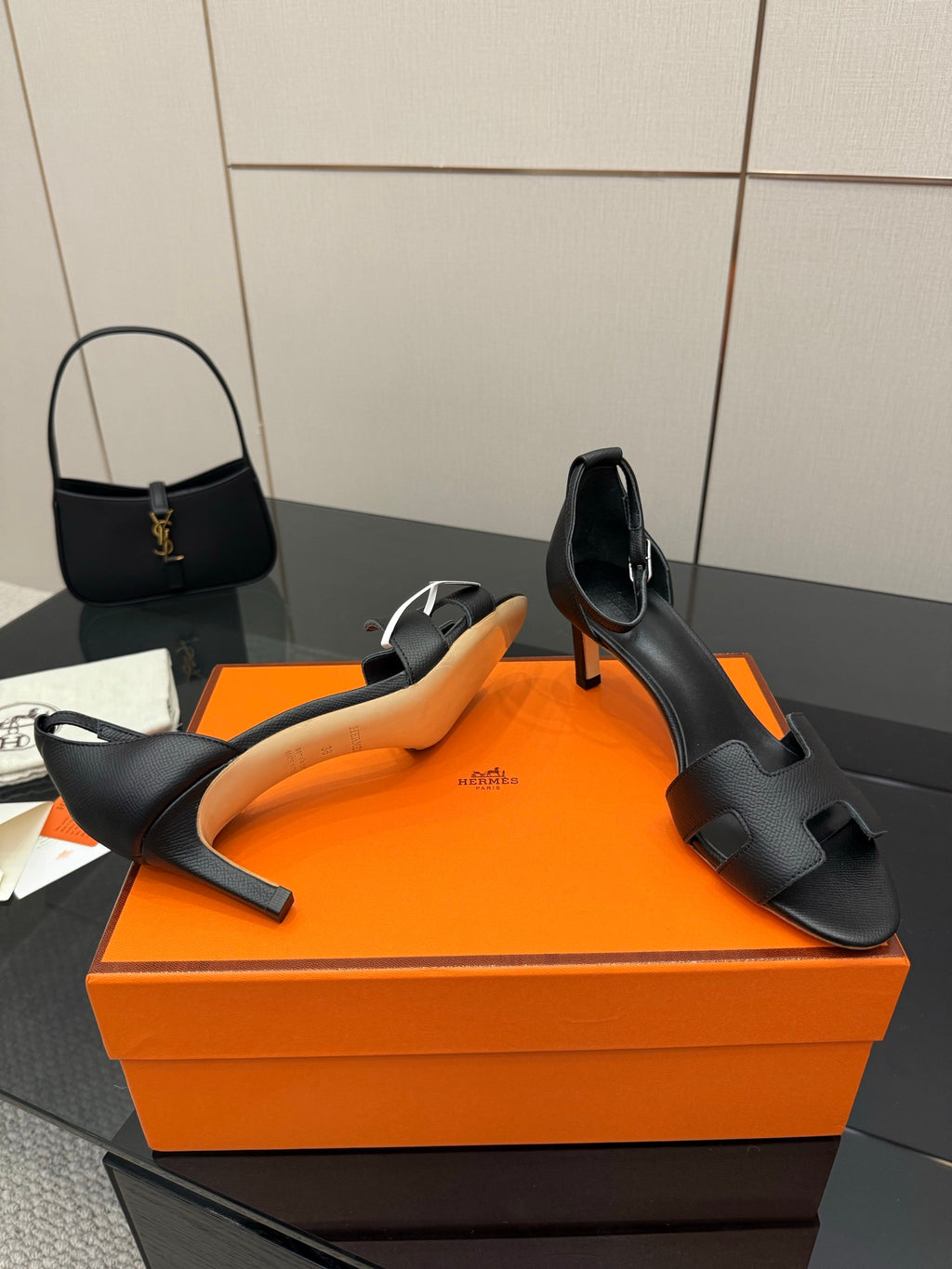 Black leather heeled mule sandals with square toe, cutout straps, and cushioned footbed