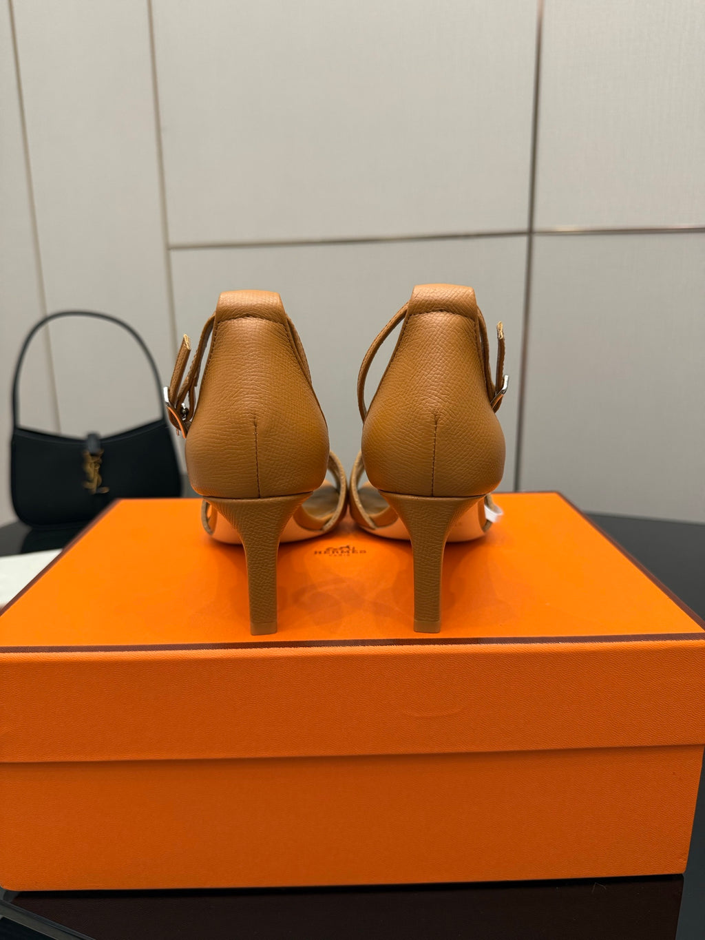 Tan leather heeled sandals, back view with ankle straps and slim heel
