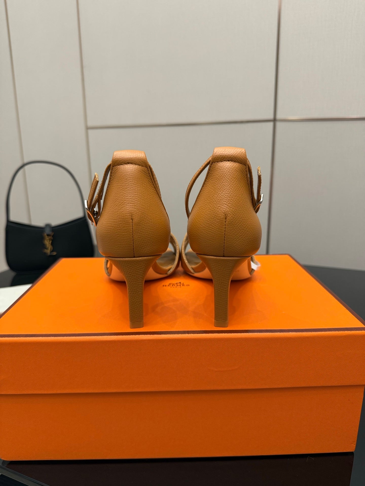 Tan leather heeled sandals, back view with ankle straps and slim heel