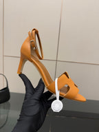 Tan leather heeled sandal with open toe and cutout ankle strap, side profile