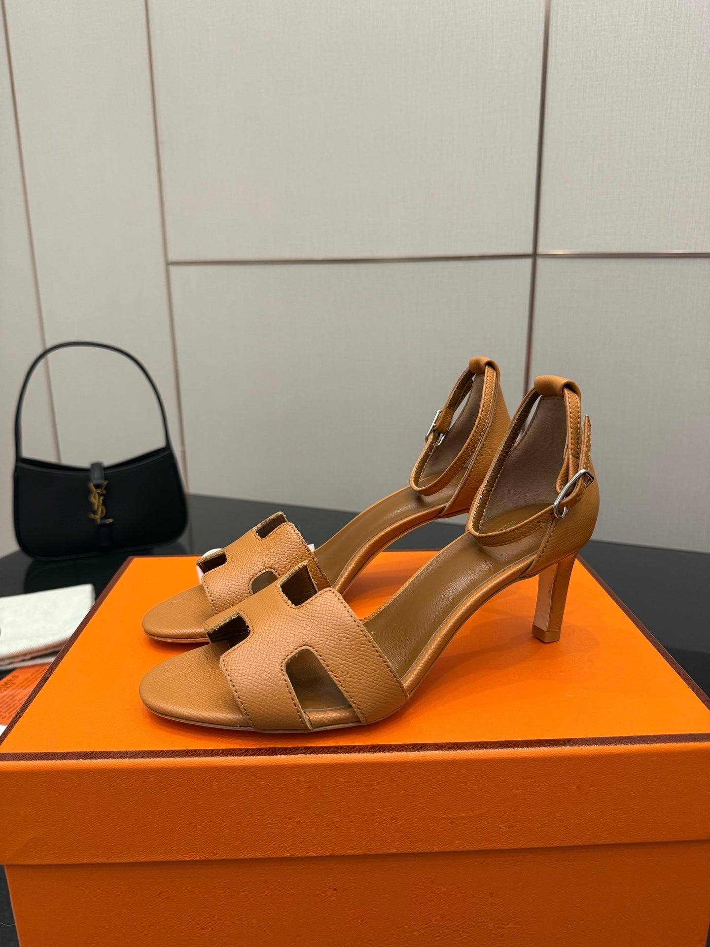 Tan leather heeled sandal with cutout strap and square toe opening, side view