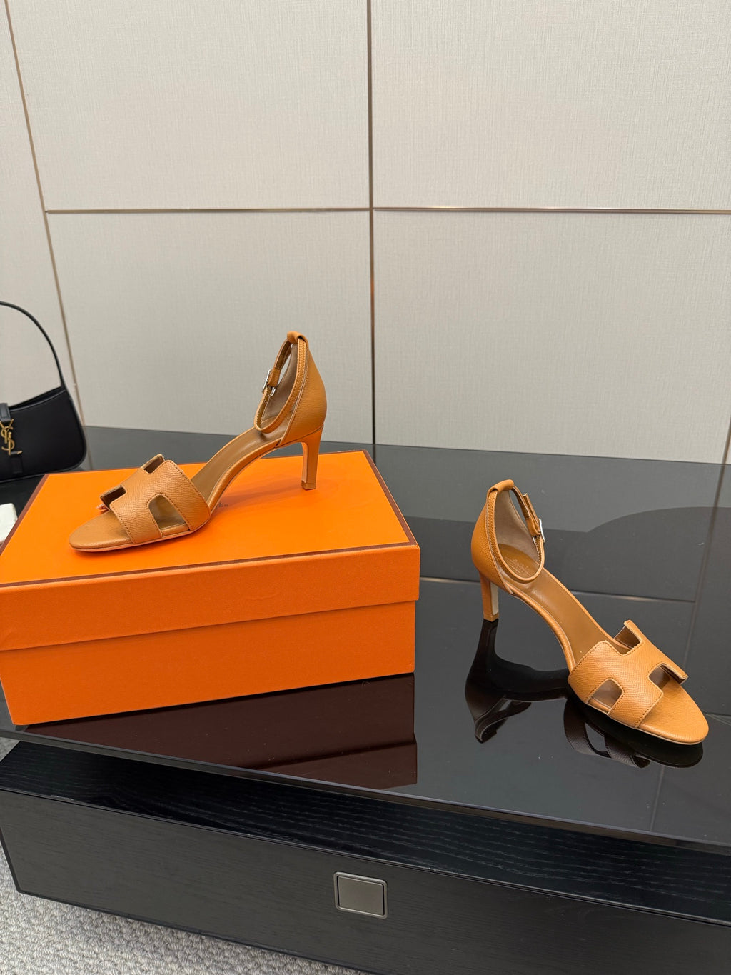 Tan leather heeled sandals with cutout straps and block heel, two-angle view