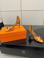 Hermes ladies tan heeled sandals side view with ankle slingback and stiletto