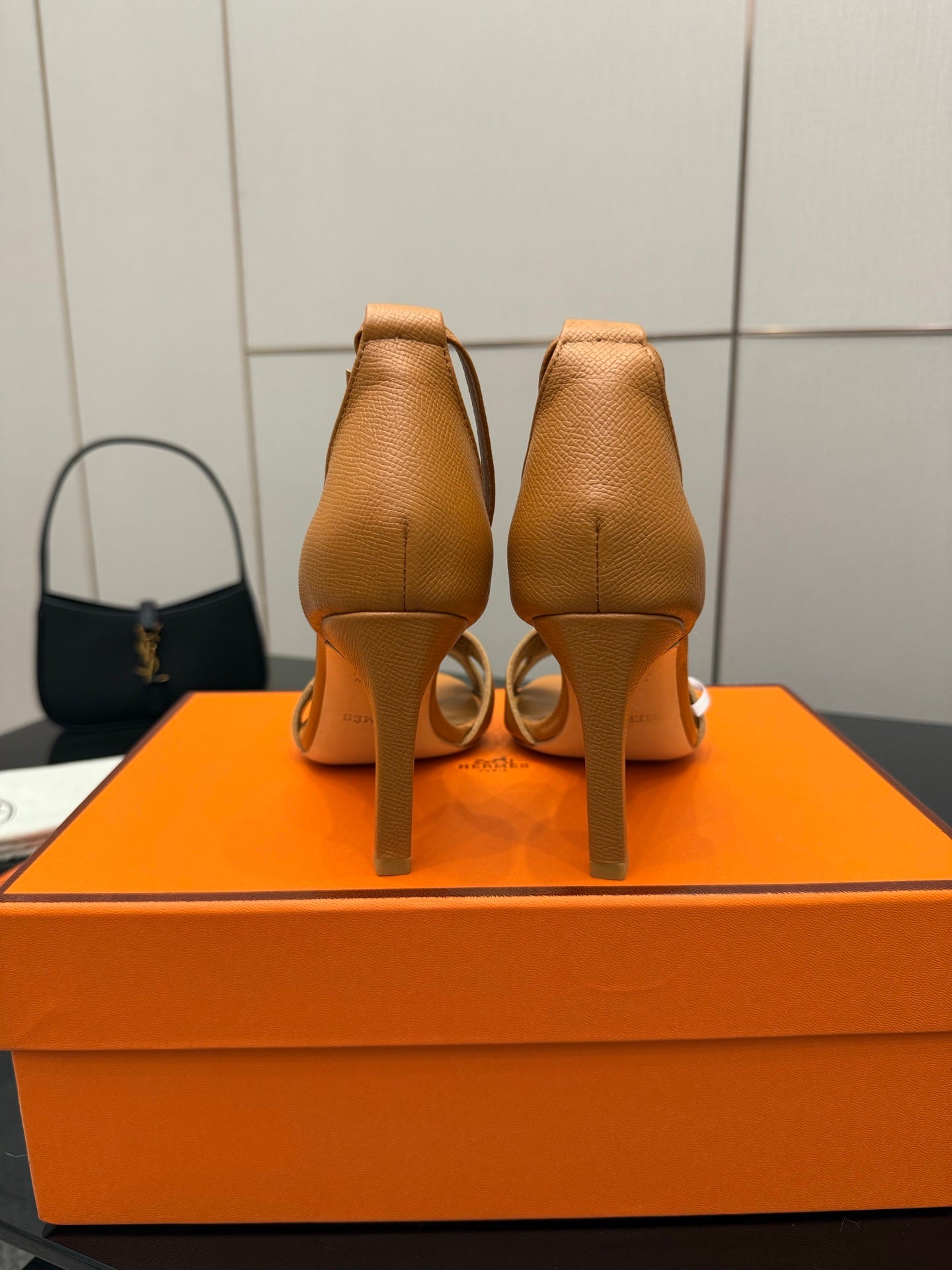 Hermes ladies tan heeled sandals, heel view showing back straps and stiletto