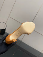Hermes tan heeled sandal sole, open-toe design, heel bottom close-up
