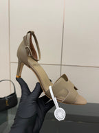 Light gray heeled sandal with ankle strap and open toe, shown upright.