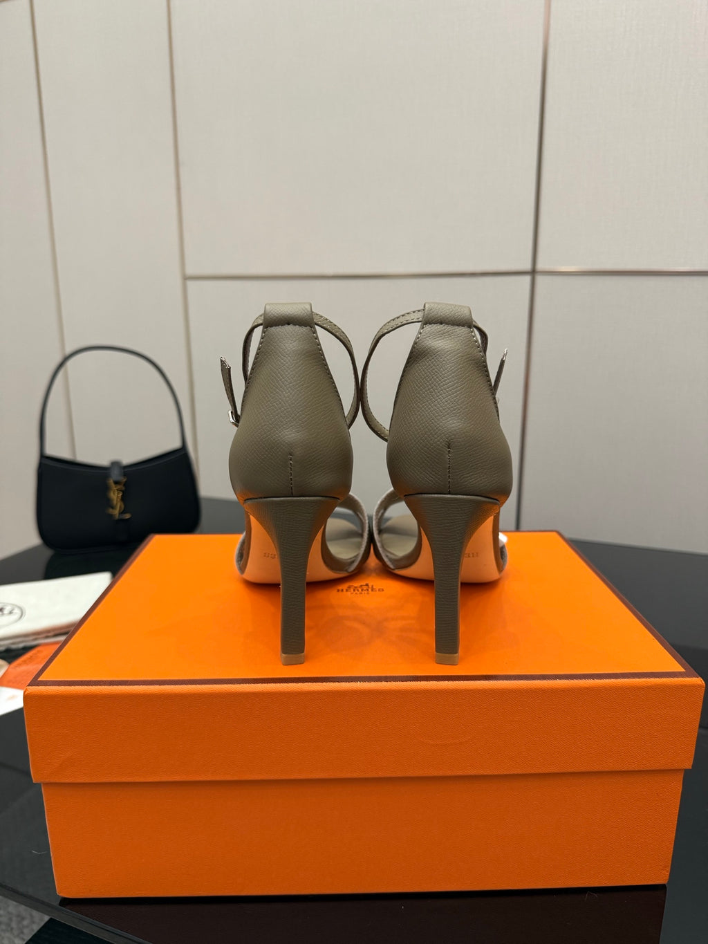 Ladies heeled sandals in light gray, back view showing heel and strap stitching