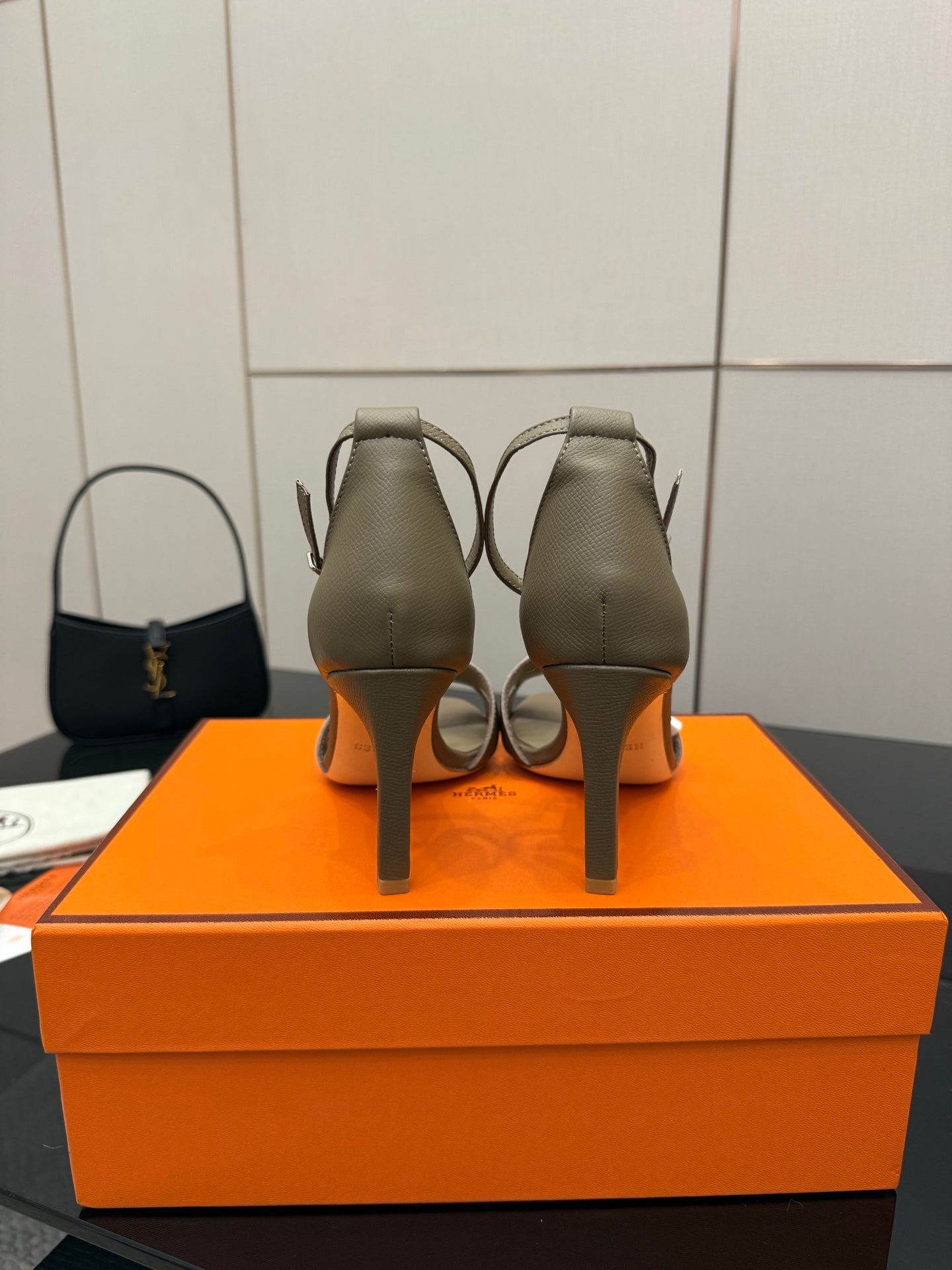 Ladies heeled sandals in light gray, back view showing heel and strap stitching