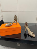 Ladies heeled sandals in light gray, side profile with high heel and ankle strap