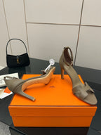 Ladies heeled sandals in light gray, front view showing cutout straps and heel