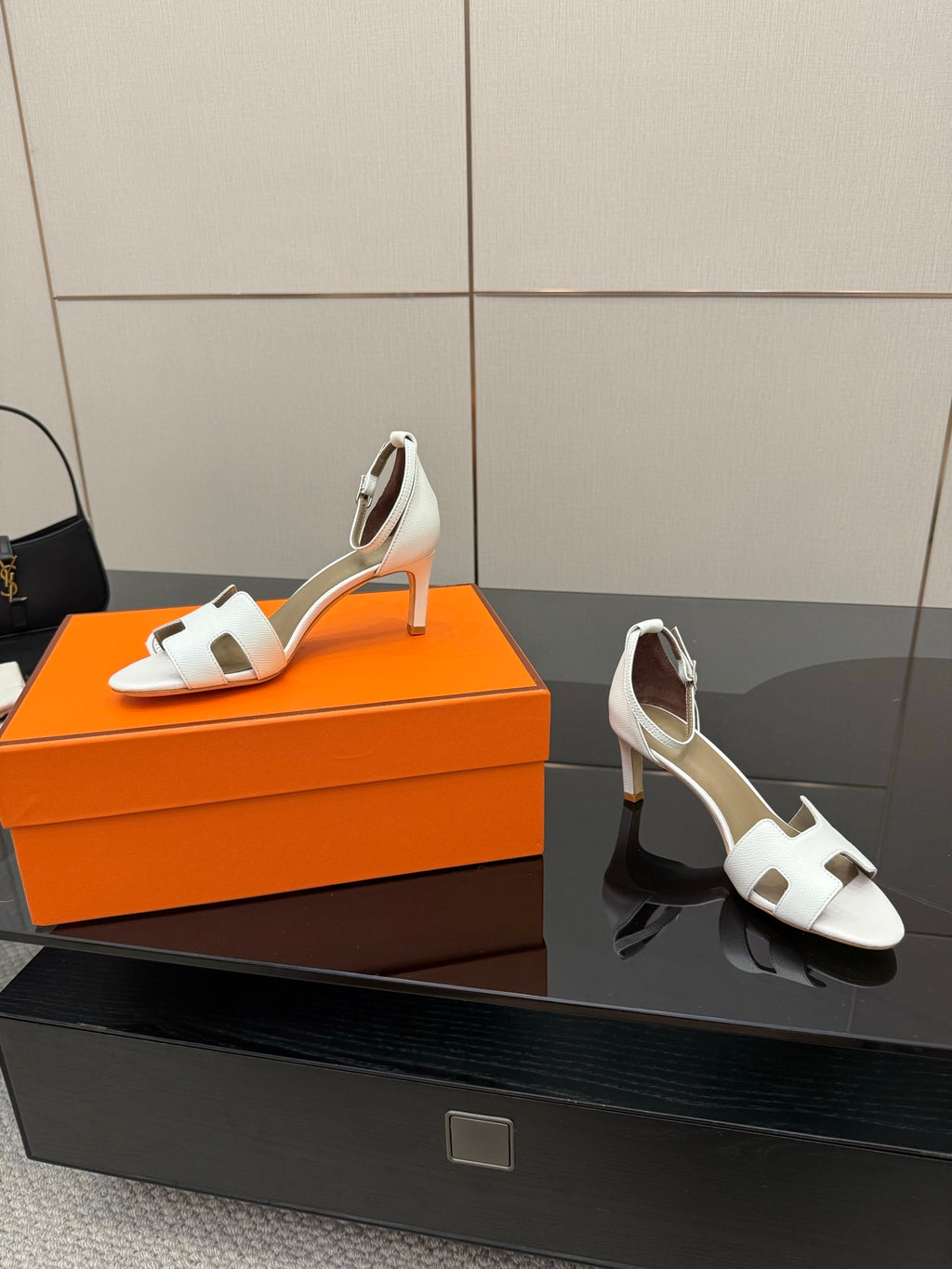 White heeled sandals with ankle strap, shown with matching pair on box