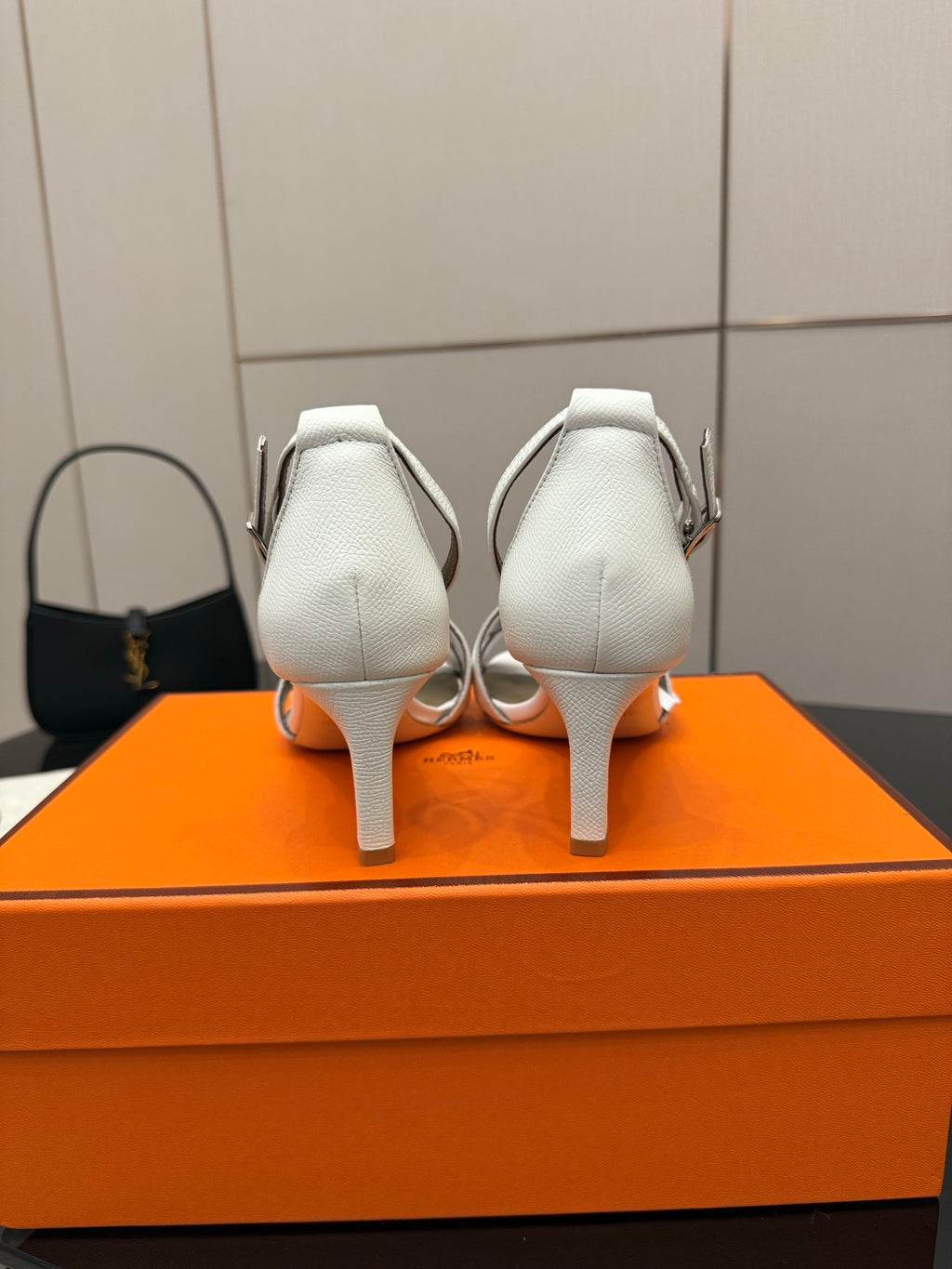 White heeled sandals, back view with adjustable ankle strap and slim heel