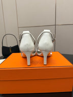 White heeled sandals, back view with adjustable ankle strap and slim heel