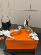 White heeled sandals with cutout strap and open toe on block heel