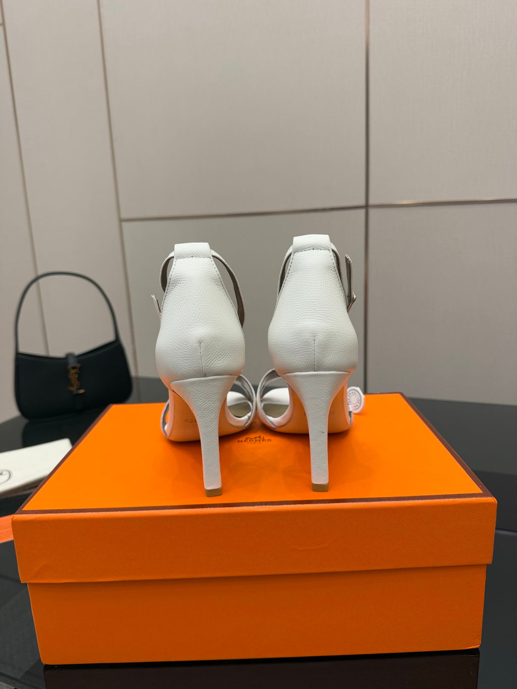 White heeled sandals, back view with ankle strap and slim block heel