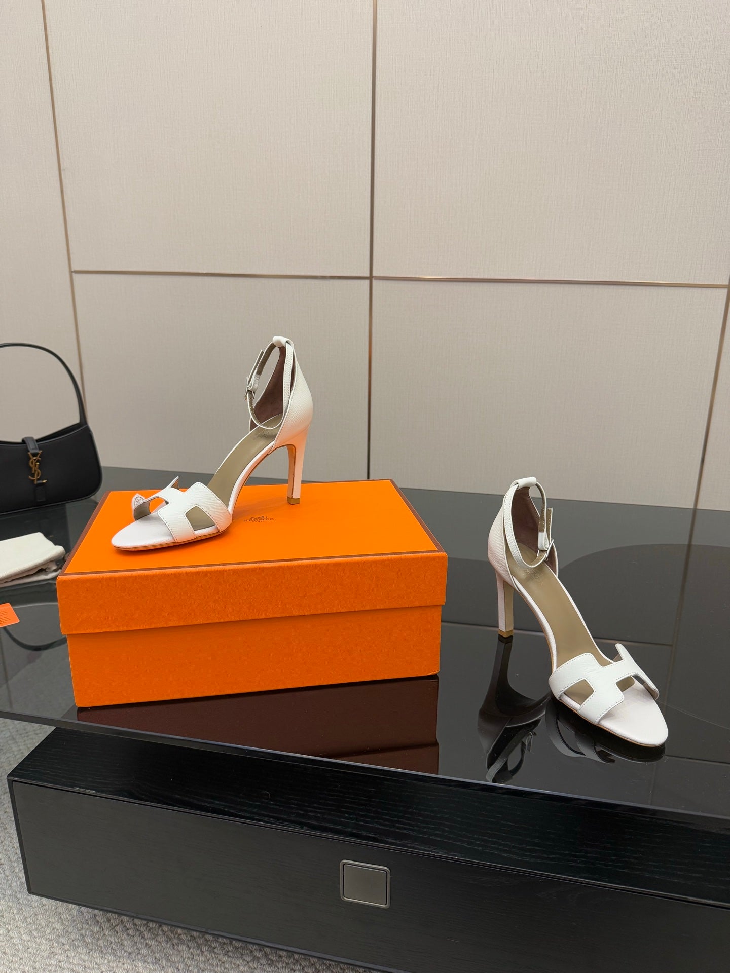 White heeled sandals, side angle view with ankle strap and block heel