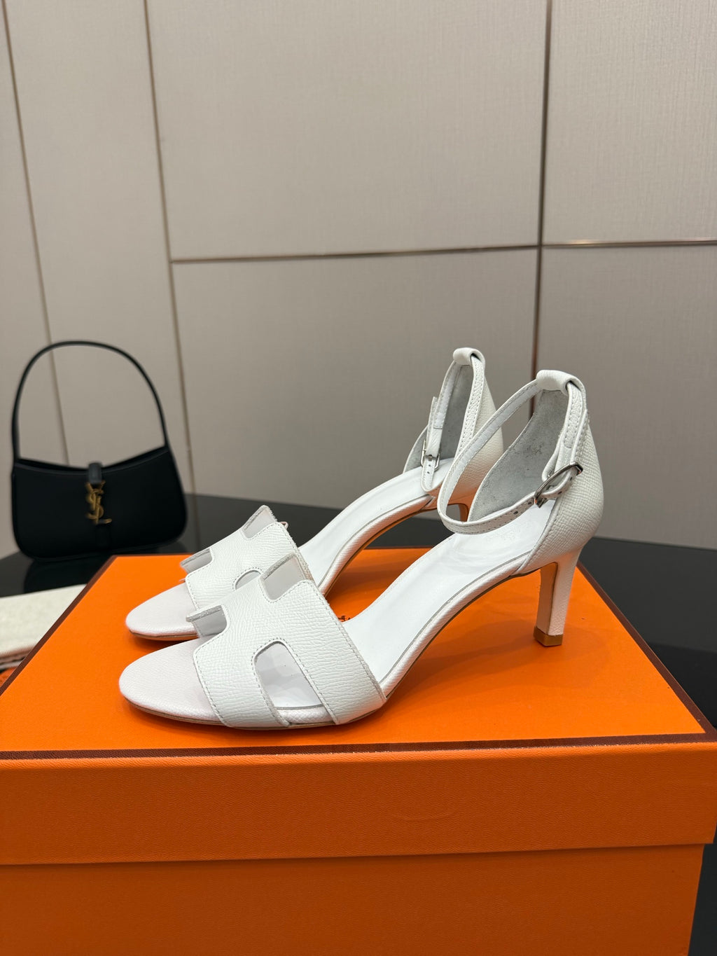 White leather slingback sandals with ankle strap, front angle