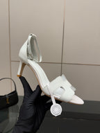 White leather slingback sandals, close side view on a heel