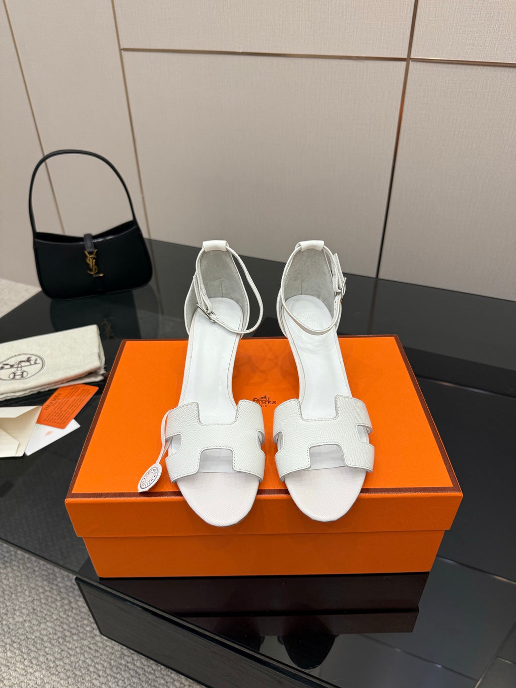 White leather sandals with ankle strap and block heel, front view